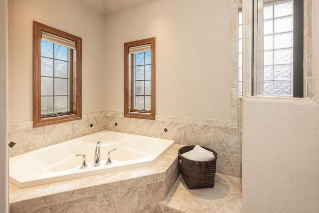 bathroom with tiled bath