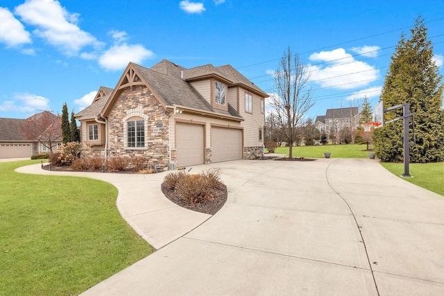 view of front of house featuring a garage and a front lawn