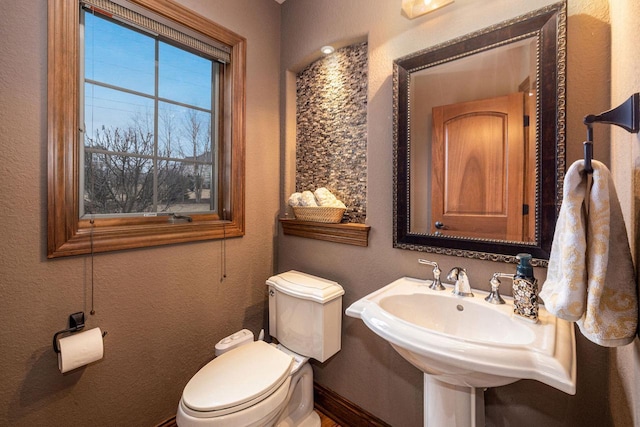 bathroom with sink and toilet