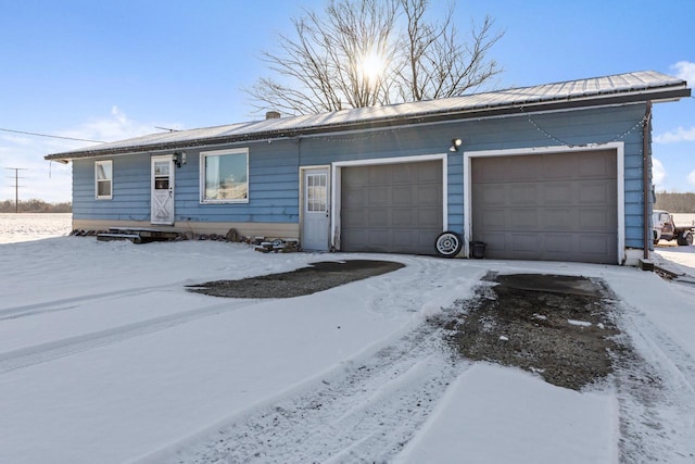 single story home featuring a garage