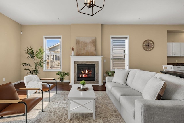 living room featuring an inviting chandelier and light hardwood / wood-style flooring