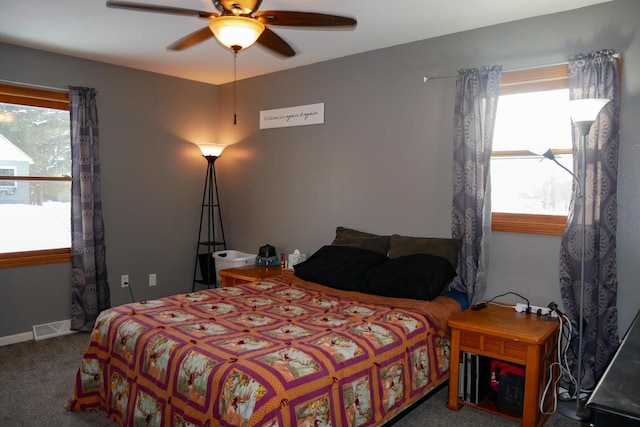 bedroom with ceiling fan and carpet