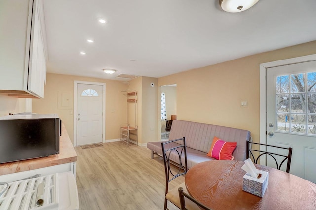 dining area with light hardwood / wood-style floors