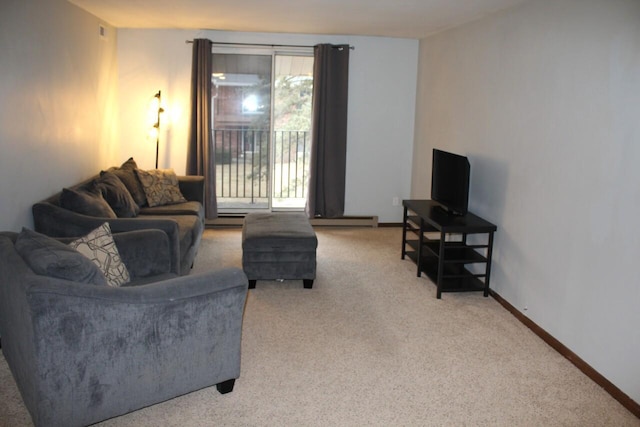 living room with a wealth of natural light, light colored carpet, and a baseboard radiator