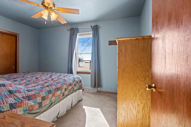 carpeted bedroom featuring ceiling fan