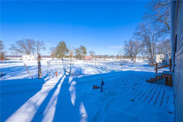 view of yard layered in snow