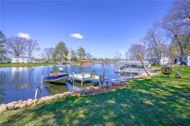 dock area featuring a water view and a lawn