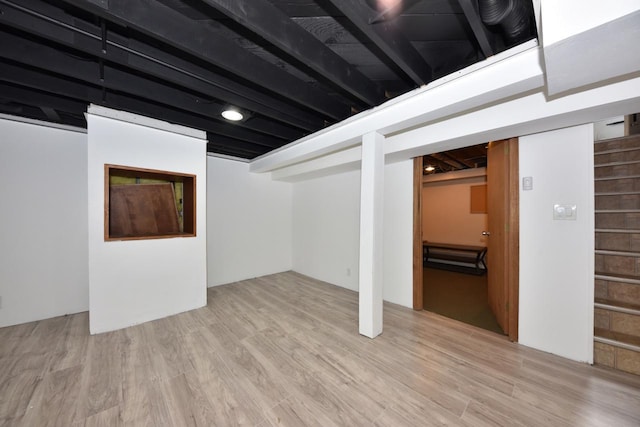 basement with light wood-type flooring