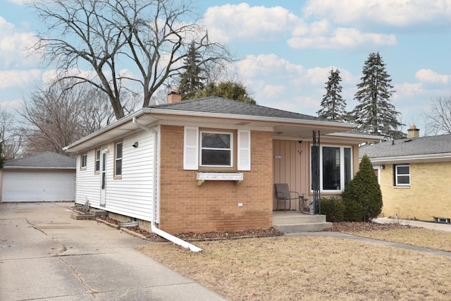 view of front of home featuring a garage and an outdoor structure