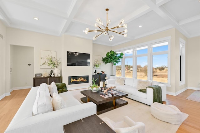 living room featuring coffered ceiling, light hardwood / wood-style floors, beamed ceiling, and an inviting chandelier