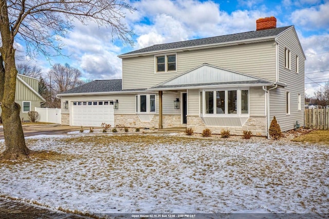 view of front of property featuring a garage