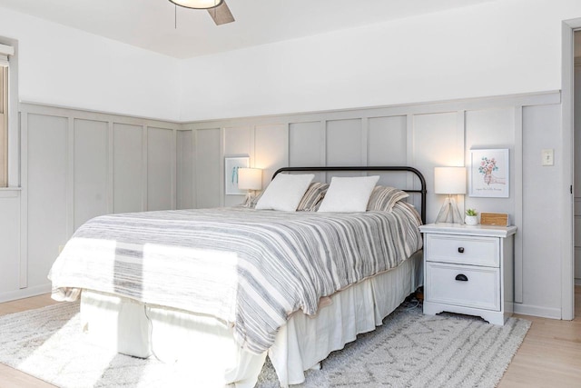 bedroom with ceiling fan and light hardwood / wood-style flooring