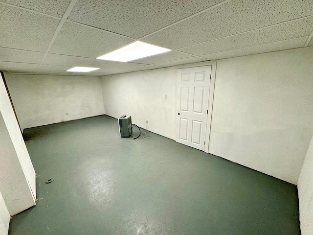 basement featuring a paneled ceiling