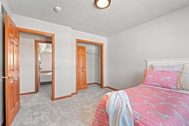 carpeted bedroom with a closet