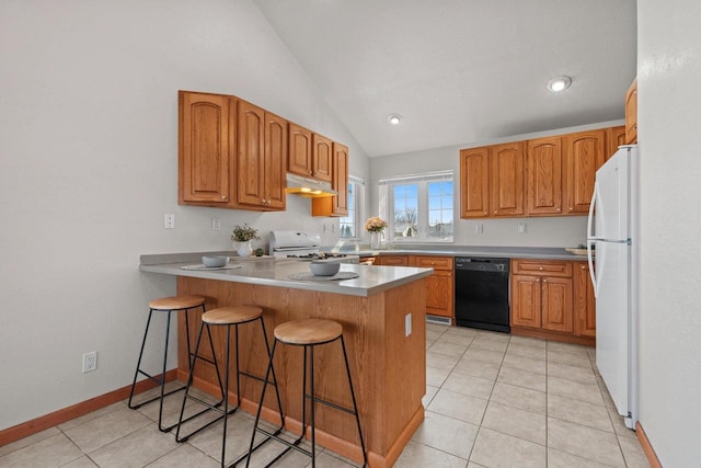 kitchen with a breakfast bar area, range, black dishwasher, kitchen peninsula, and white fridge