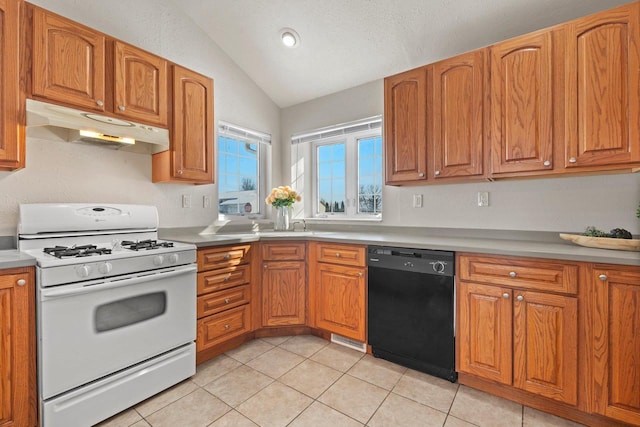 kitchen featuring vaulted ceiling, a textured ceiling, light tile patterned floors, white range with gas cooktop, and dishwasher