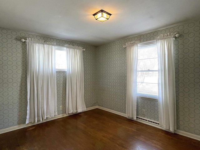 spare room featuring dark hardwood / wood-style floors