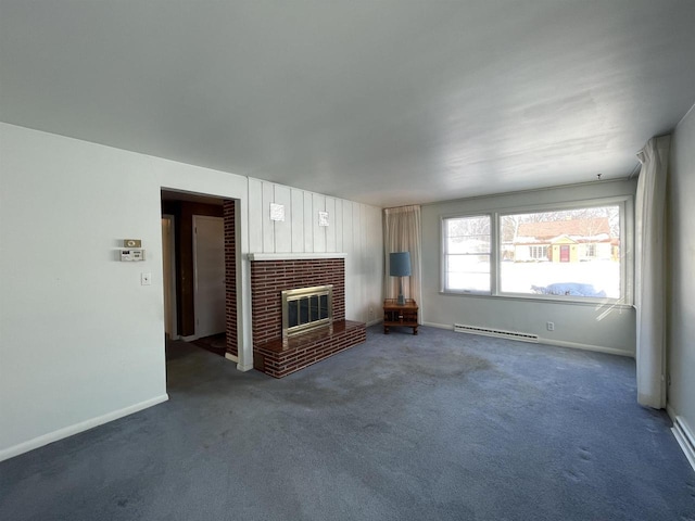 unfurnished living room featuring a brick fireplace, dark carpet, and baseboard heating