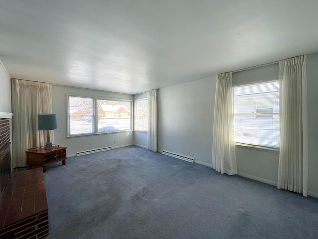 unfurnished living room featuring a baseboard radiator, a fireplace, and dark colored carpet