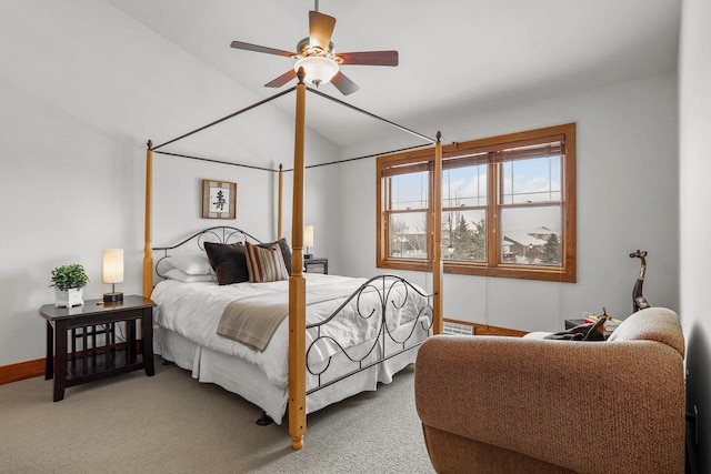 bedroom with ceiling fan, lofted ceiling, and carpet floors