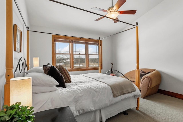 bedroom featuring ceiling fan and carpet