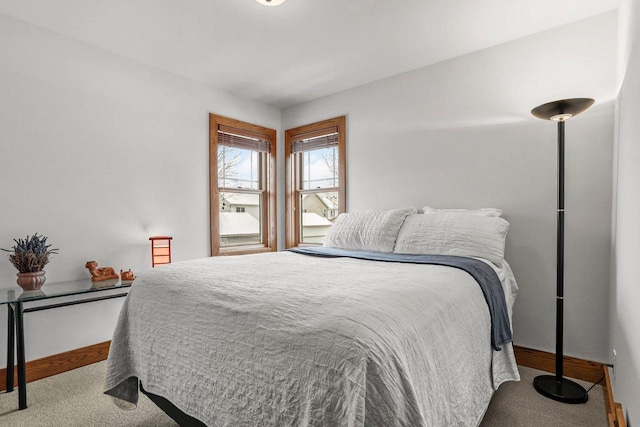 bedroom featuring light colored carpet