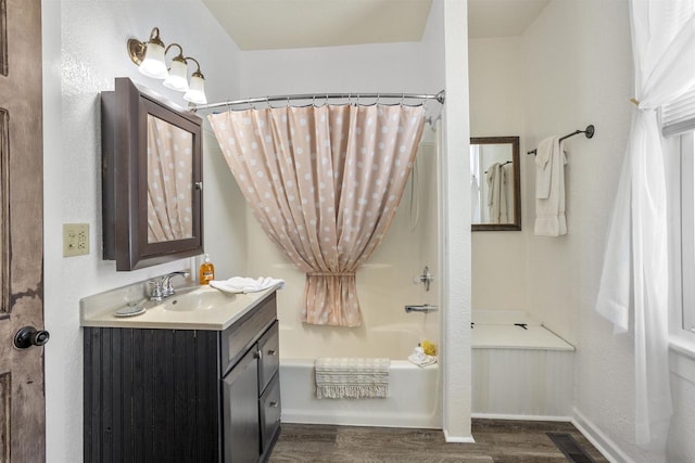 51 W 10th Ave, Oshkosh, WI 54902 - bathroom with vanity, hardwood / wood-style flooring, and shower / bath combo with shower curtain