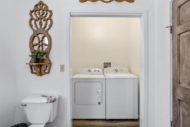 51 W 10th Ave, Oshkosh, WI 54902 - laundry room with dark hardwood / wood-style flooring and washing machine and dryer