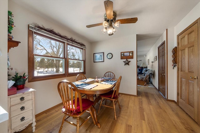 dining space featuring ceiling fan and light hardwood / wood-style floors