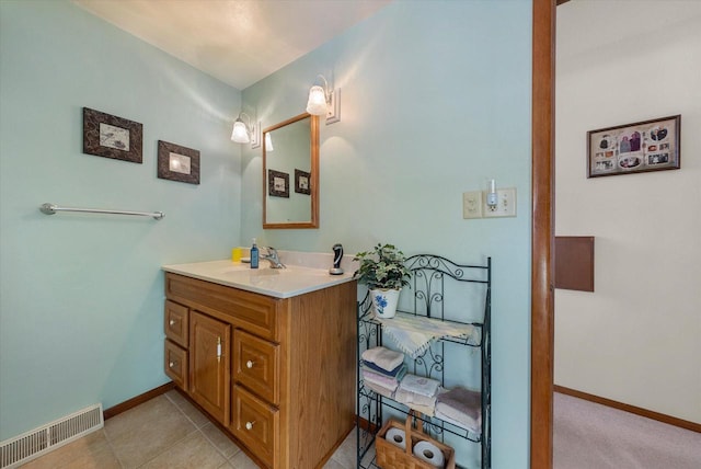 bathroom with vanity and tile patterned flooring