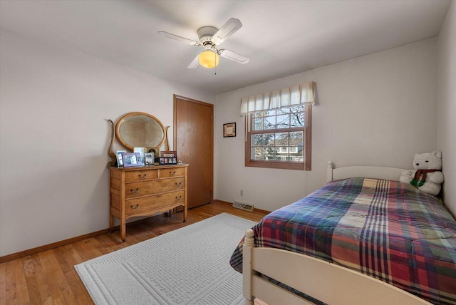 bedroom featuring light hardwood / wood-style flooring and ceiling fan