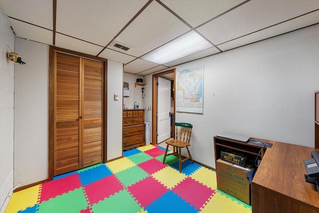 playroom featuring a paneled ceiling