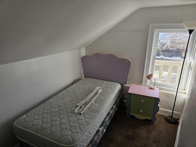 carpeted bedroom featuring vaulted ceiling