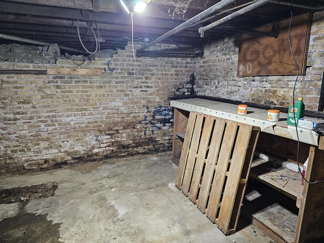 basement with brick wall