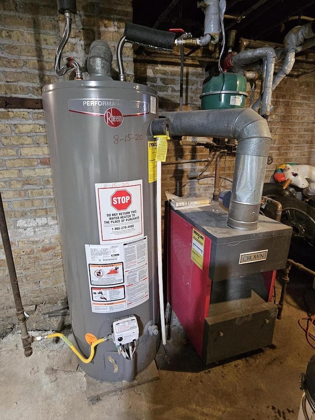 utility room featuring gas water heater