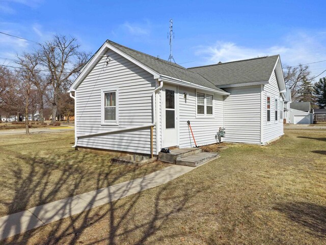 505 S Howard St, Princeton, WI 54968 - back of house with a yard and roof with shingles