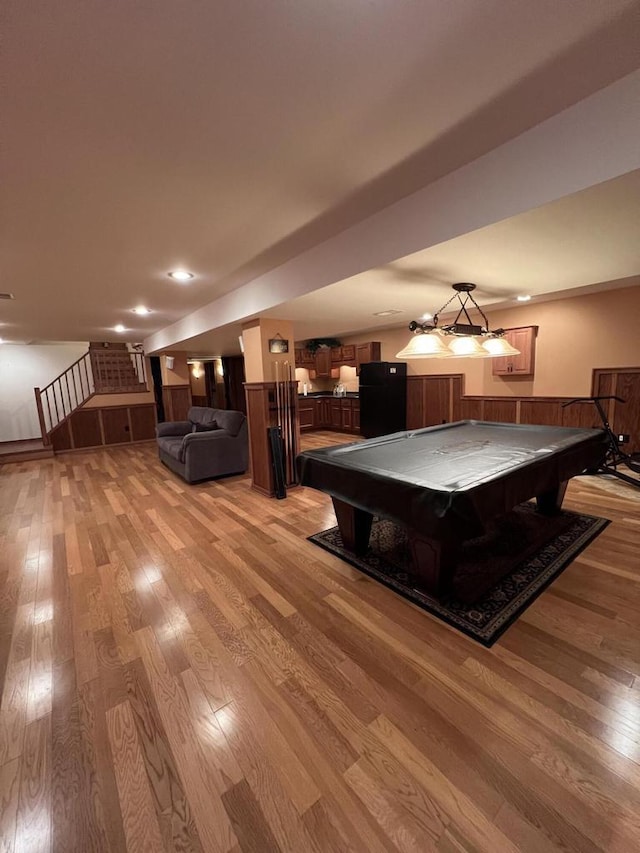 rec room with light hardwood / wood-style flooring and billiards