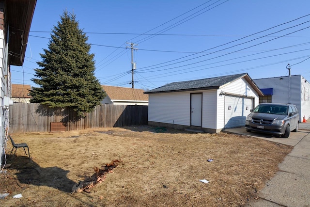 exterior space featuring a garage and an outdoor structure