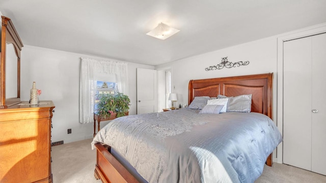 bedroom featuring light carpet