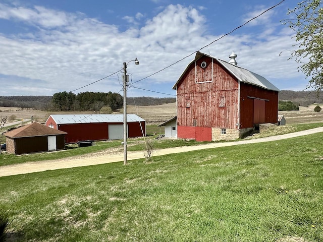 N19027 County Road F, Trempealeau, WI 54661 - view of barn featuring a lawn and dirt driveway