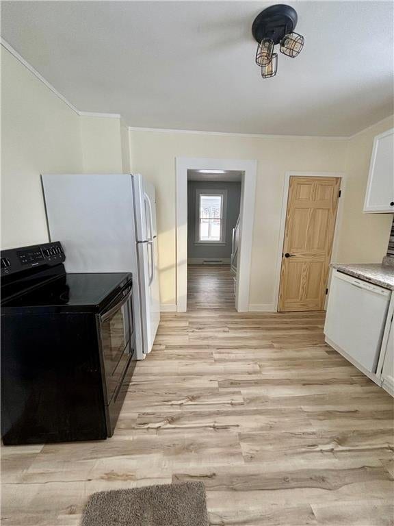 kitchen with dishwasher, black / electric stove, light hardwood / wood-style floors, and white cabinets