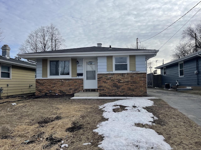 bungalow-style house featuring central AC unit