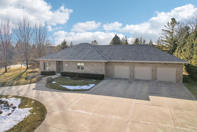 ranch-style home featuring a garage