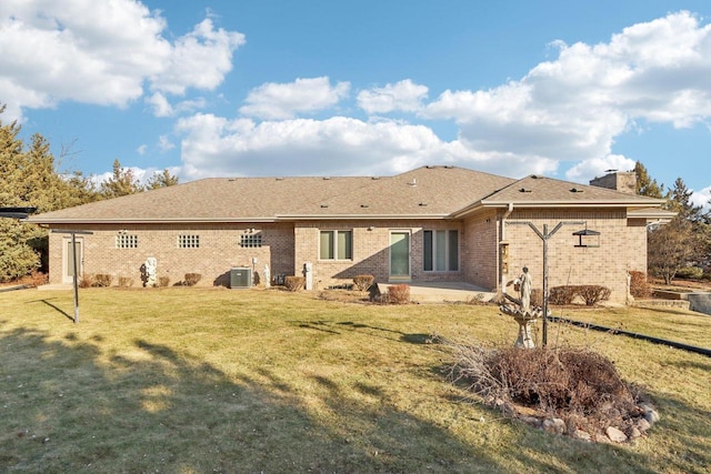 back of property featuring a yard, central AC, and a patio area