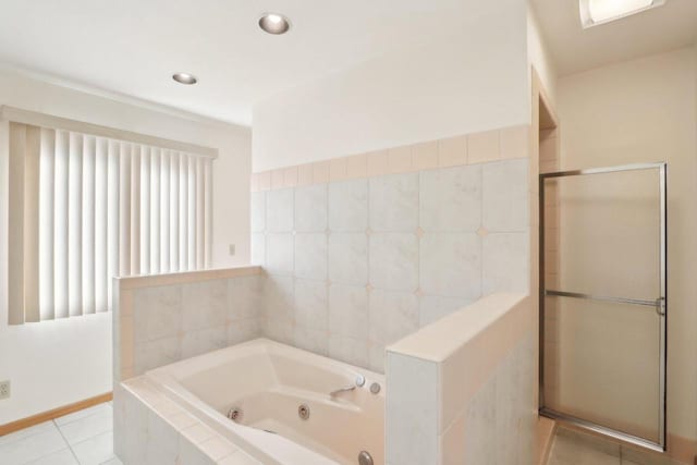 bathroom with independent shower and bath and tile patterned floors