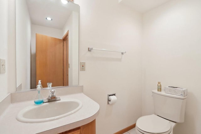 bathroom with vanity and toilet