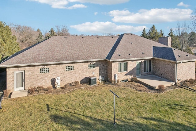 rear view of property featuring cooling unit, a patio area, and a lawn