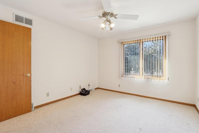 spare room with carpet and ceiling fan