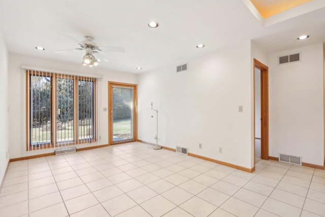 tiled empty room with ceiling fan