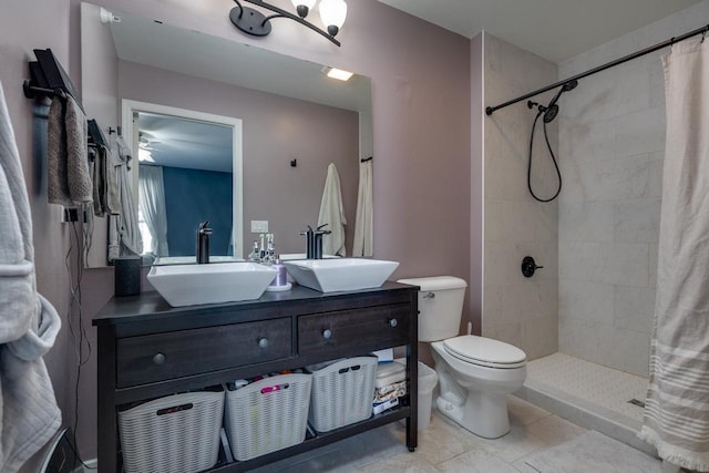 bathroom featuring toilet, a shower with curtain, and vanity